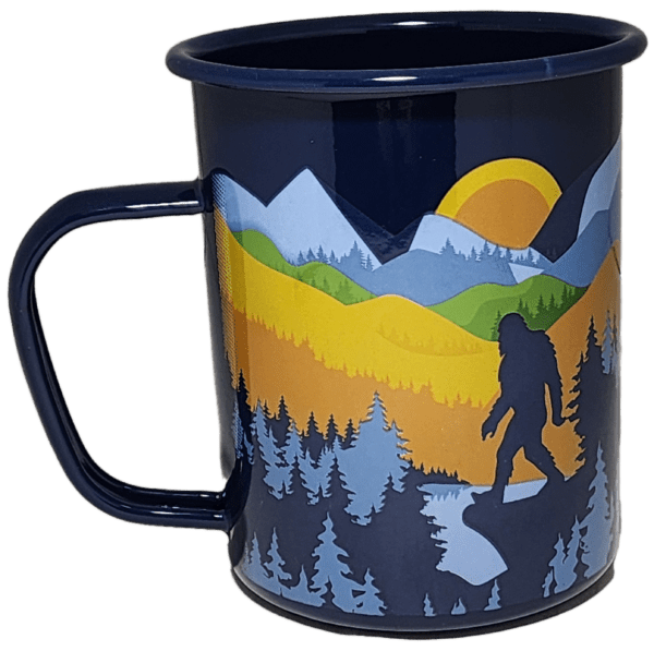 A blue cup with a picture of trees and mountains.