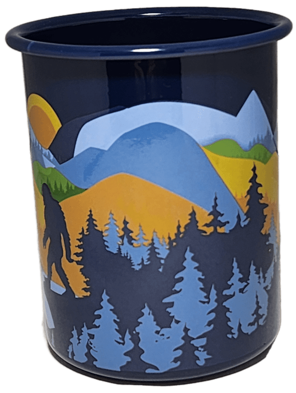 A blue cup with trees and mountains on it