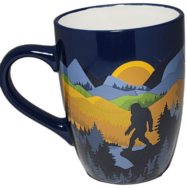 A blue mug with a picture of a bigfoot on it.