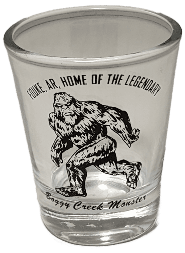 A shot glass with an image of a gorilla on it.