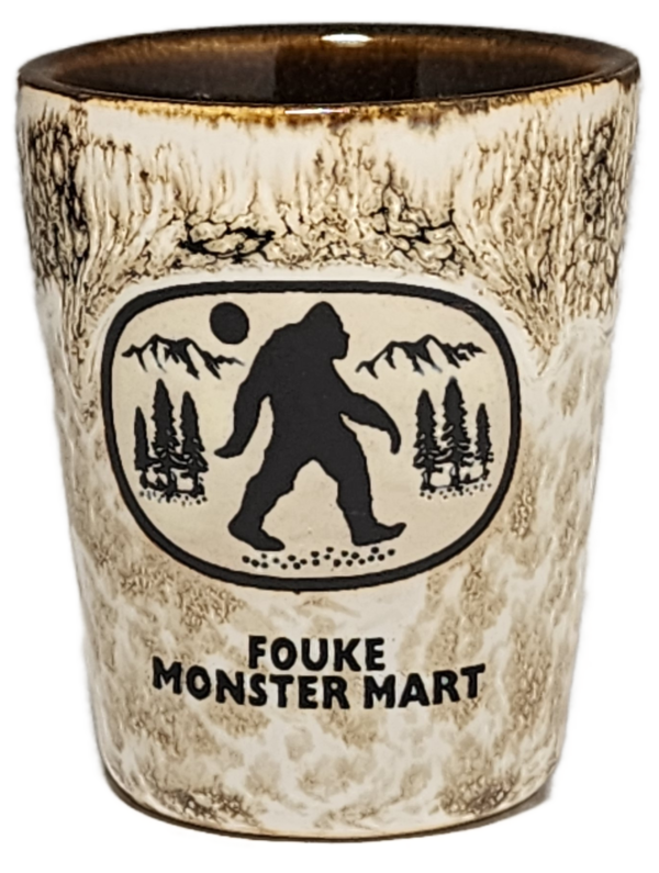 A cup with an image of a bigfoot on it.