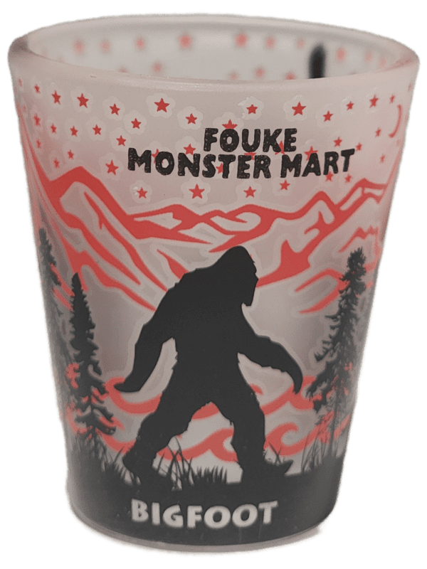 A cup with a picture of bigfoot on it.