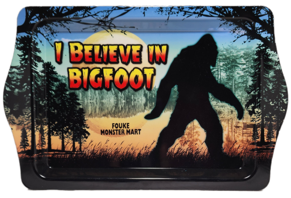 A picture of a bigfoot in front of trees.