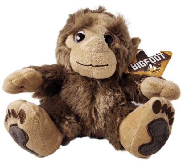 A stuffed animal monkey with a tag on its ear.