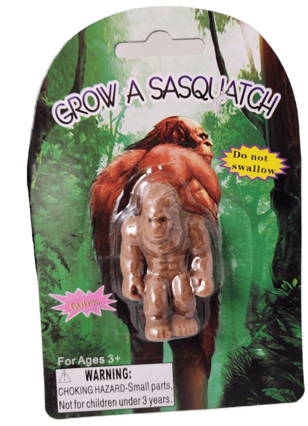 A toy gorilla is in the package on its back.