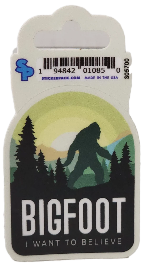 A sticker of bigfoot with trees and sun in the background.