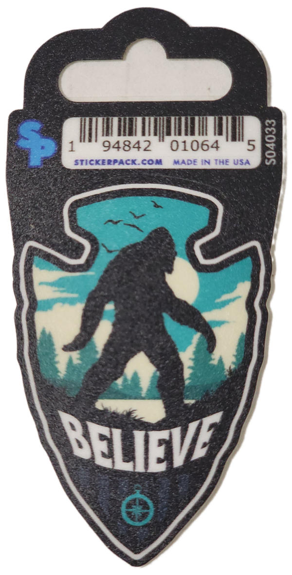 A sticker of a bigfoot with trees and birds.