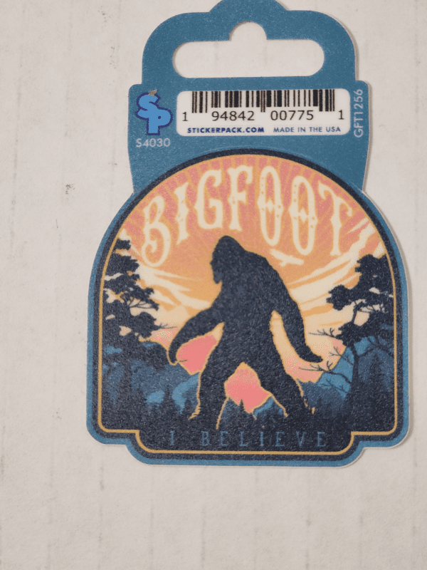 A sticker of bigfoot is hanging on the wall.