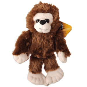 A stuffed animal is wearing a brown and white outfit.