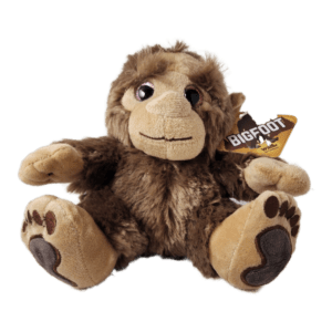 A stuffed monkey with a tag on its ear.