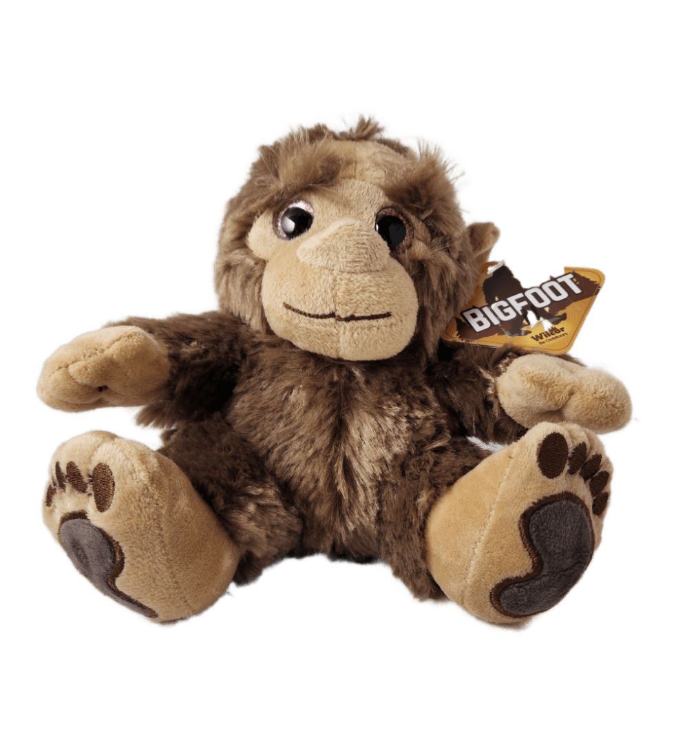 A stuffed monkey with a tag on its ear.