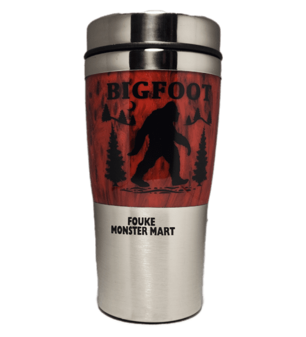 A stainless steel travel mug with a picture of bigfoot on it.