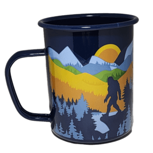 A cup with a picture of a bear and trees