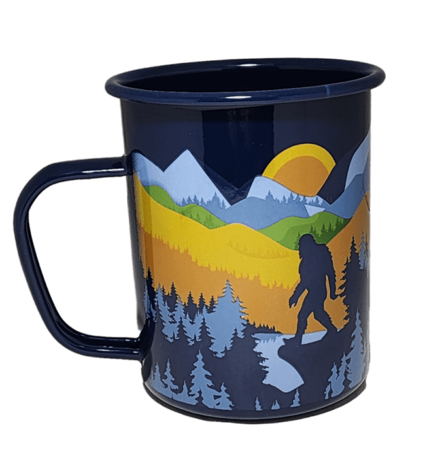 A cup with a picture of a bear and trees