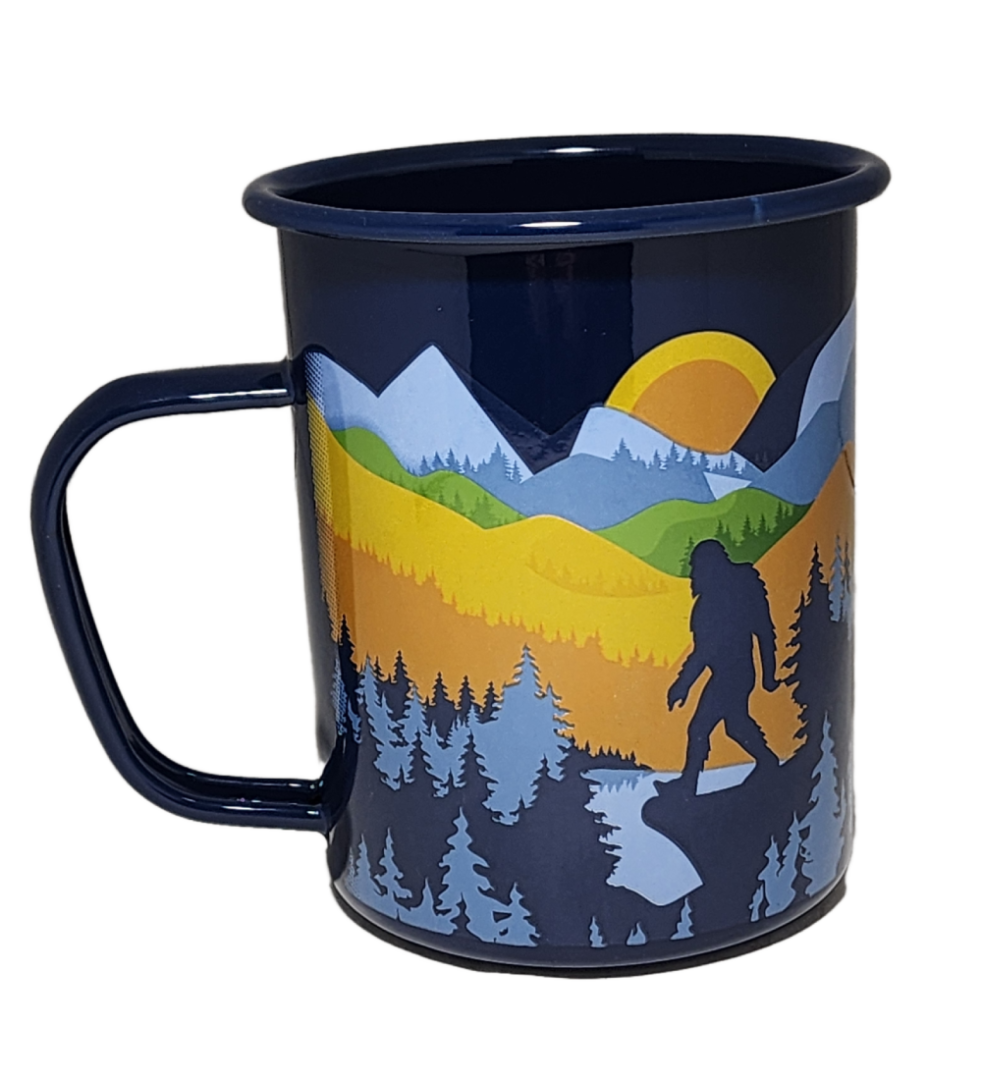 A cup with a picture of a bear and trees