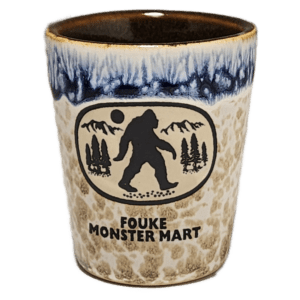 A cup with a picture of bigfoot on it.