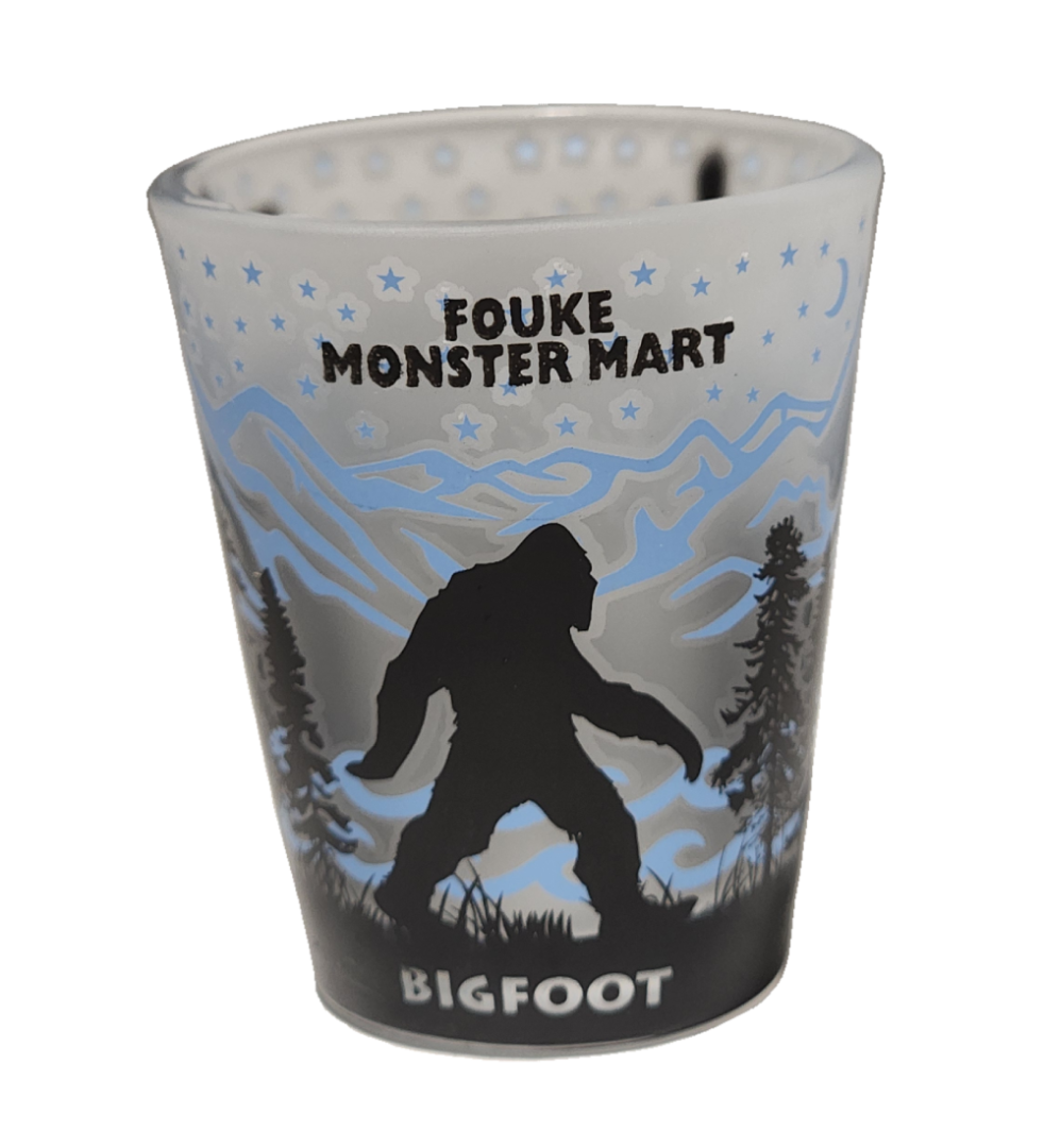 A cup with a picture of bigfoot on it.