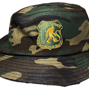 A camouflage hat with the u. S. Army emblem on it