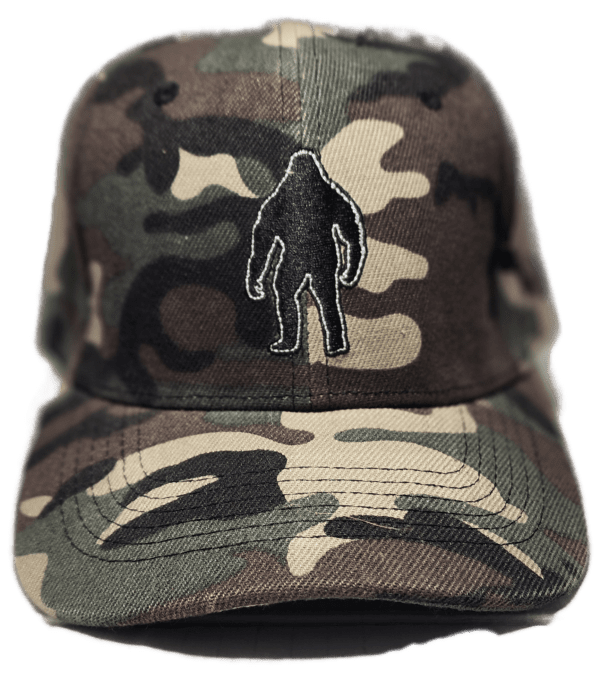 A baseball cap with a bigfoot patch on it.