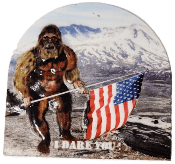 A picture of a bigfoot holding an american flag.