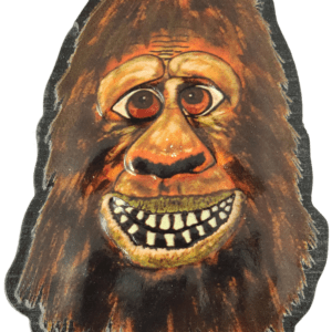 A painting of a bigfoot mask with teeth.