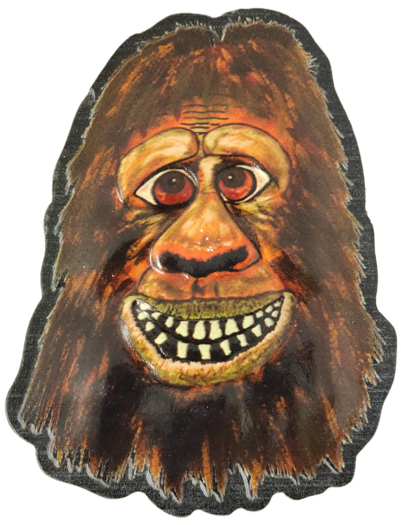 A painting of a bigfoot mask with teeth.