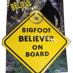 A yellow sign that says bigfoot believer on board.