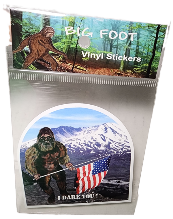 A sticker of an american flag and a bigfoot.