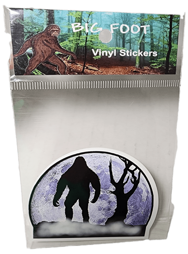 A sticker of a bigfoot and a tree.