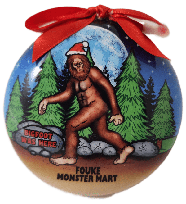 A christmas ornament with a picture of bigfoot.