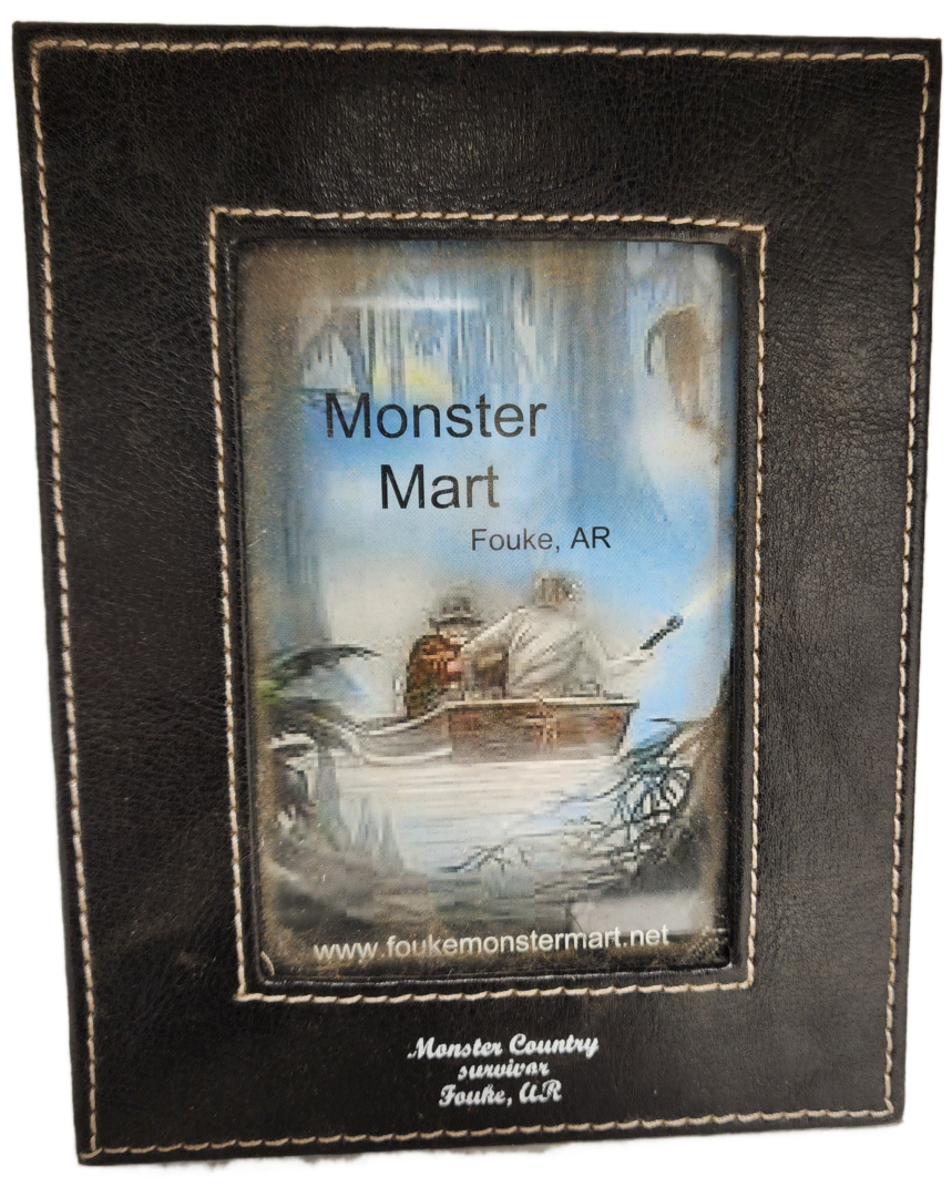 A picture frame with the words " monster mart " written on it.