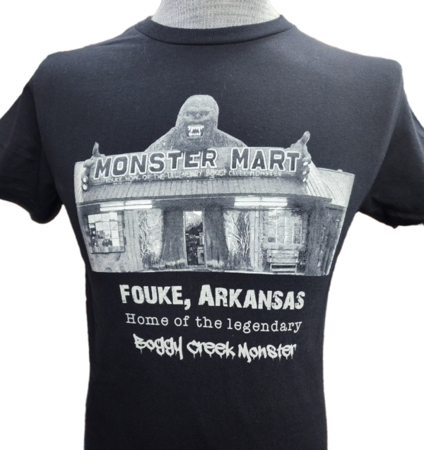 A black t-shirt with an image of the monster market.