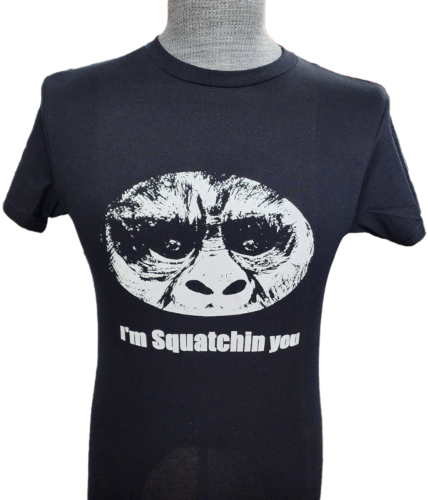 A t-shirt with an image of a gorilla wearing sunglasses.