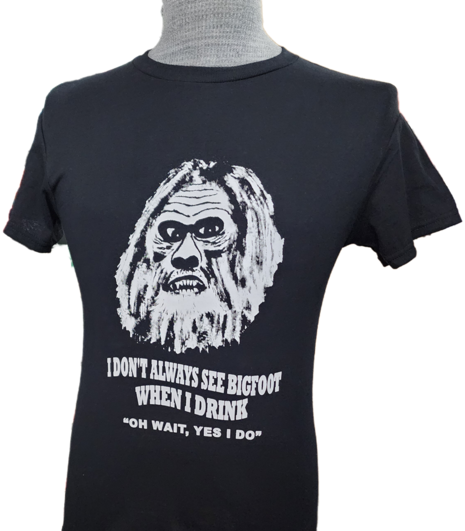 A t-shirt with an old man 's face and the words " don 't always see bigfoot when i drink ".