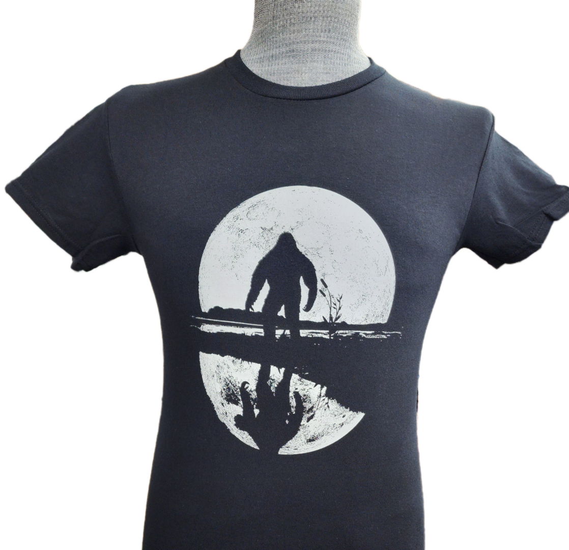 A t-shirt with an image of a man standing on the beach.