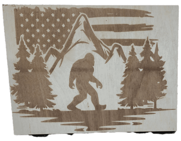 A picture of an american flag and trees with a bigfoot.