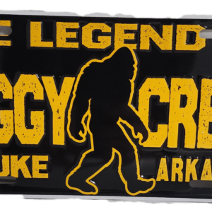 A black and yellow sign with an image of bigfoot.