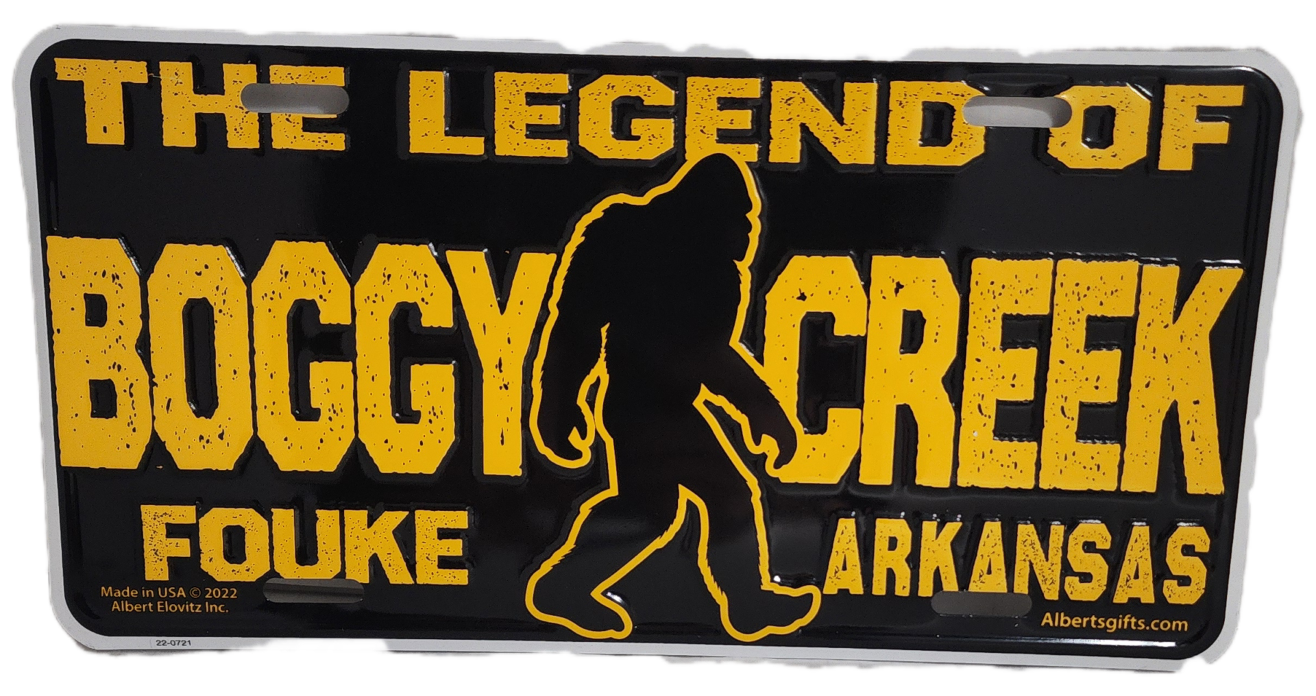 A black and yellow sign with an image of bigfoot.