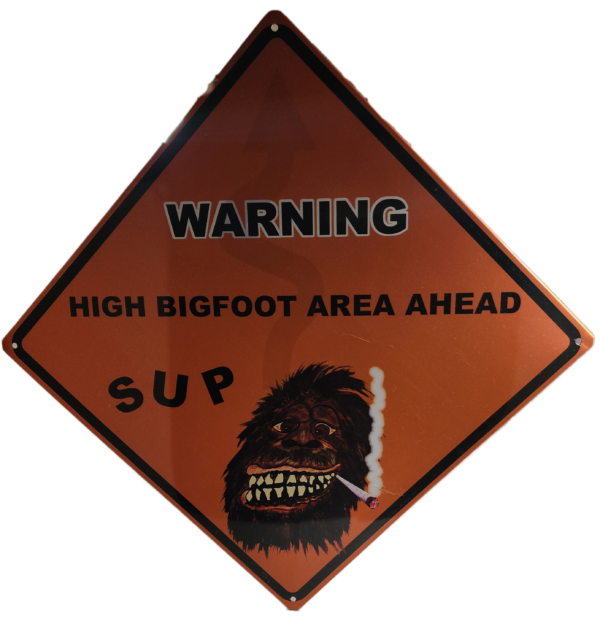 A warning sign with an image of a bigfoot.