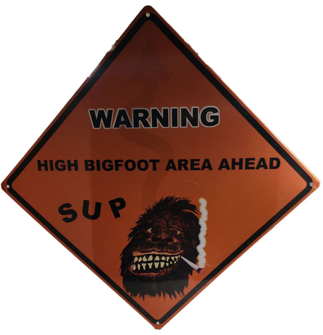 A warning sign with an image of a bigfoot.