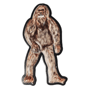 A stuffed animal of a bigfoot is standing.