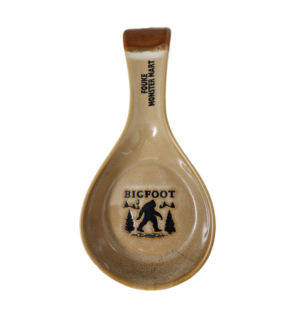 A spoon rest with bigfoot written on it.