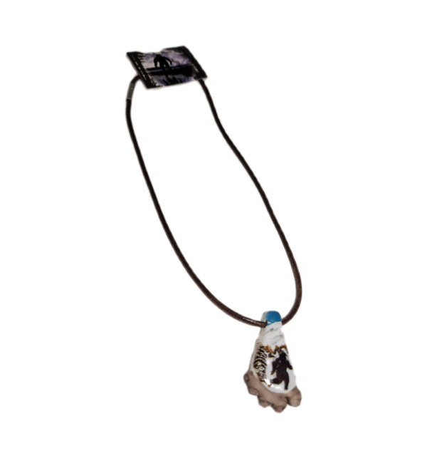 A necklace with a blue stone on it.