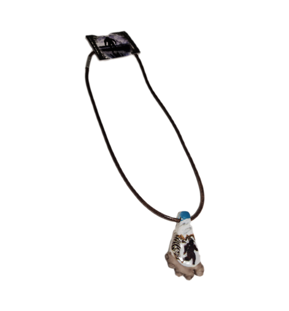 A necklace with a blue stone on it.