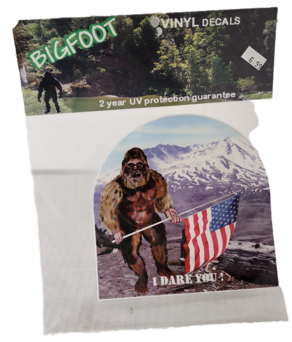 A picture of a bigfoot and an american flag.