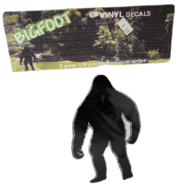 A picture of a bigfoot sticker and a black figure.