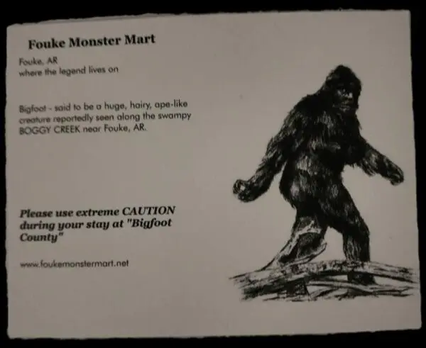 A picture of the back of a card with an image of a bigfoot.