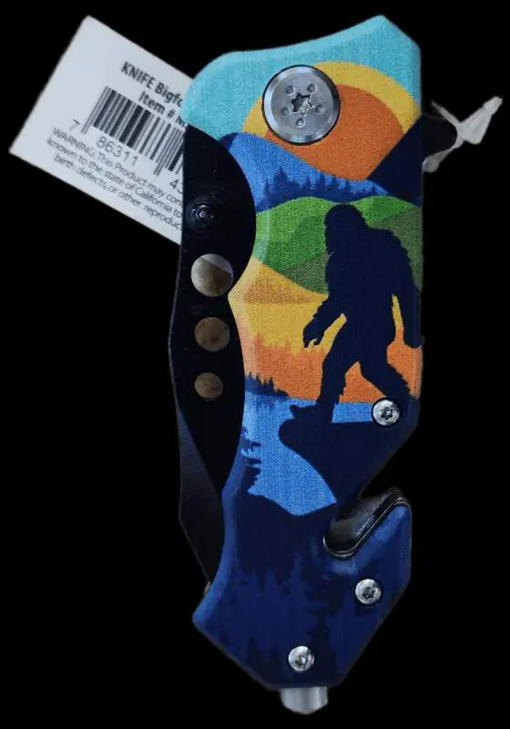 A knife with a picture of a bigfoot on it.